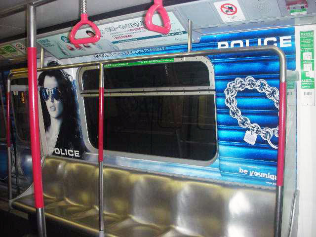 POLICE Advertising on the Hong Kong MTR Mass Transit Railway - Saloon Window Girl Jewelry Ad